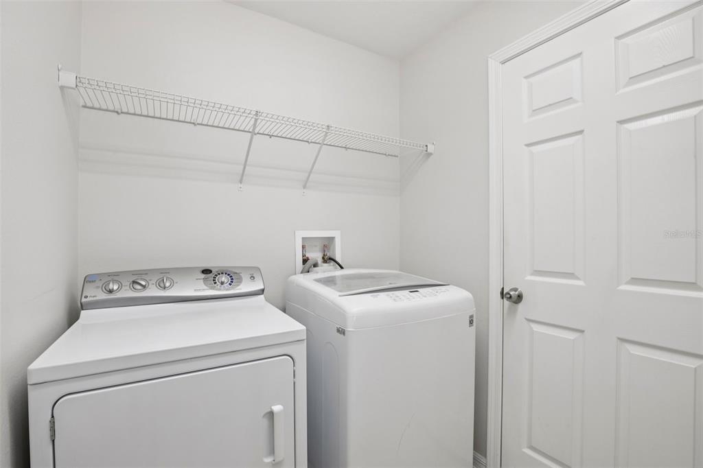 106 Star Shell Drive Apollo Beach, FL 33572 - Photo 16 of 33 a utility room with dryer and washer