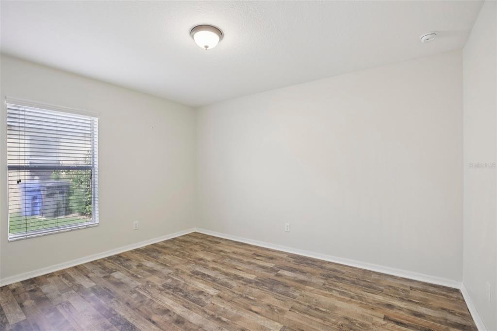 106 Star Shell Drive Apollo Beach, FL 33572 - Photo 18 of 33 wooden floor in an empty room with a window