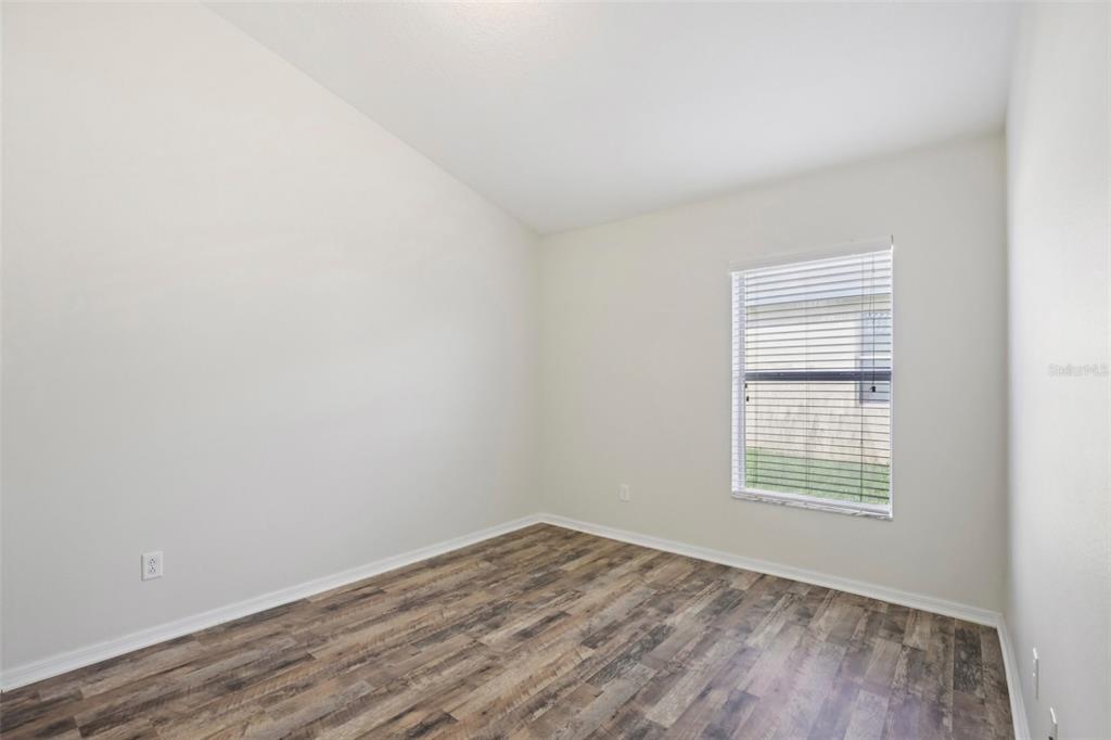 106 Star Shell Drive Apollo Beach, FL 33572 - Photo 21 of 33 wooden floor in an empty room with a window