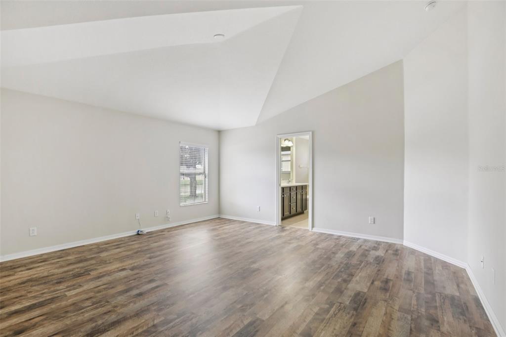 106 Star Shell Drive Apollo Beach, FL 33572 - Photo 23 of 33 a view of an empty room with wooden floor