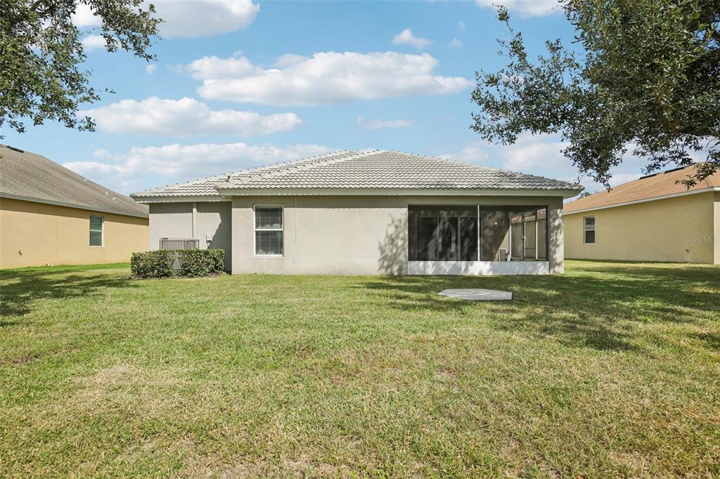 106 Star Shell Drive Apollo Beach, FL 33572 - Photo 30 of 33 a front view of a house with a garden