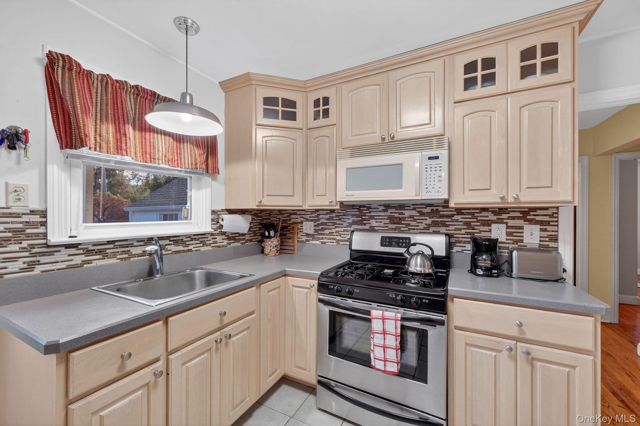 14 Ruppert Road Poughkeepsie, NY 12603 - Photo 15 of 35 a kitchen with stainless steel appliances granite countertop a sink a stove and cabinets