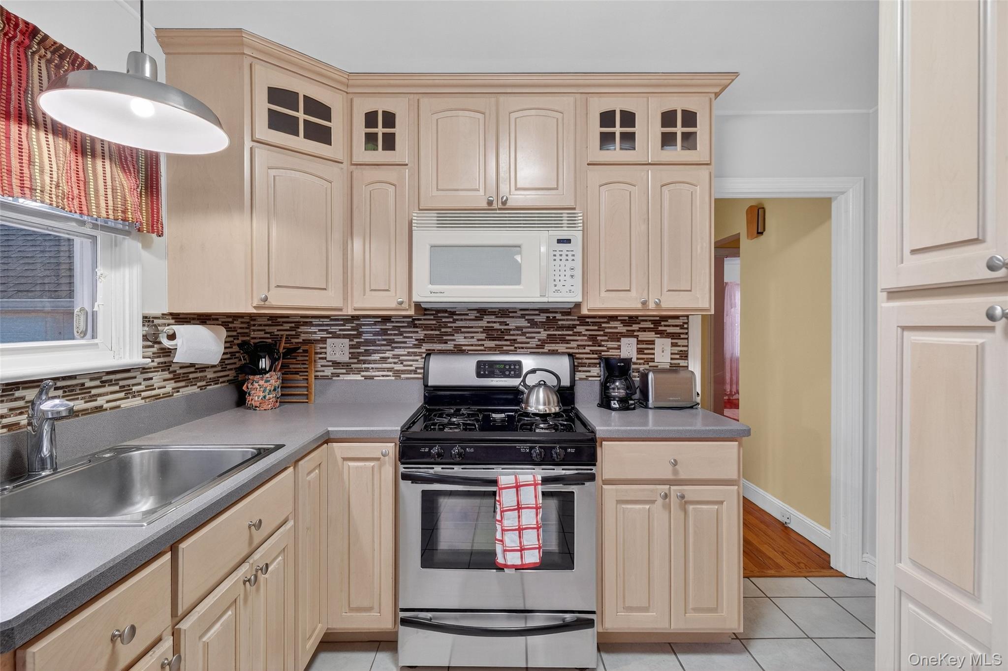 14 Ruppert Road Poughkeepsie, NY 12603 - Photo 16 of 35 a kitchen with stainless steel appliances granite countertop a stove a sink and a microwave