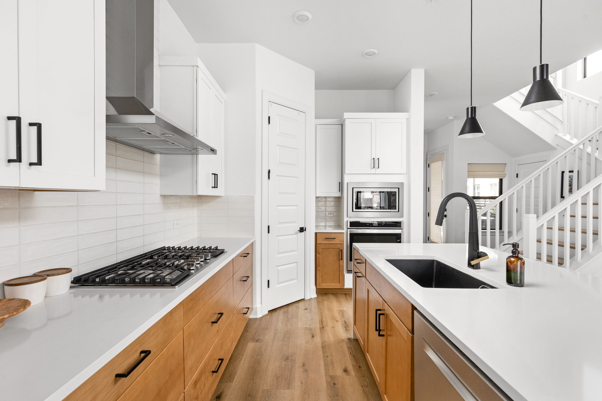 4710 Eberly Street Austin, TX 78723 - Photo 10 of 36 a kitchen that has a sink and a stove