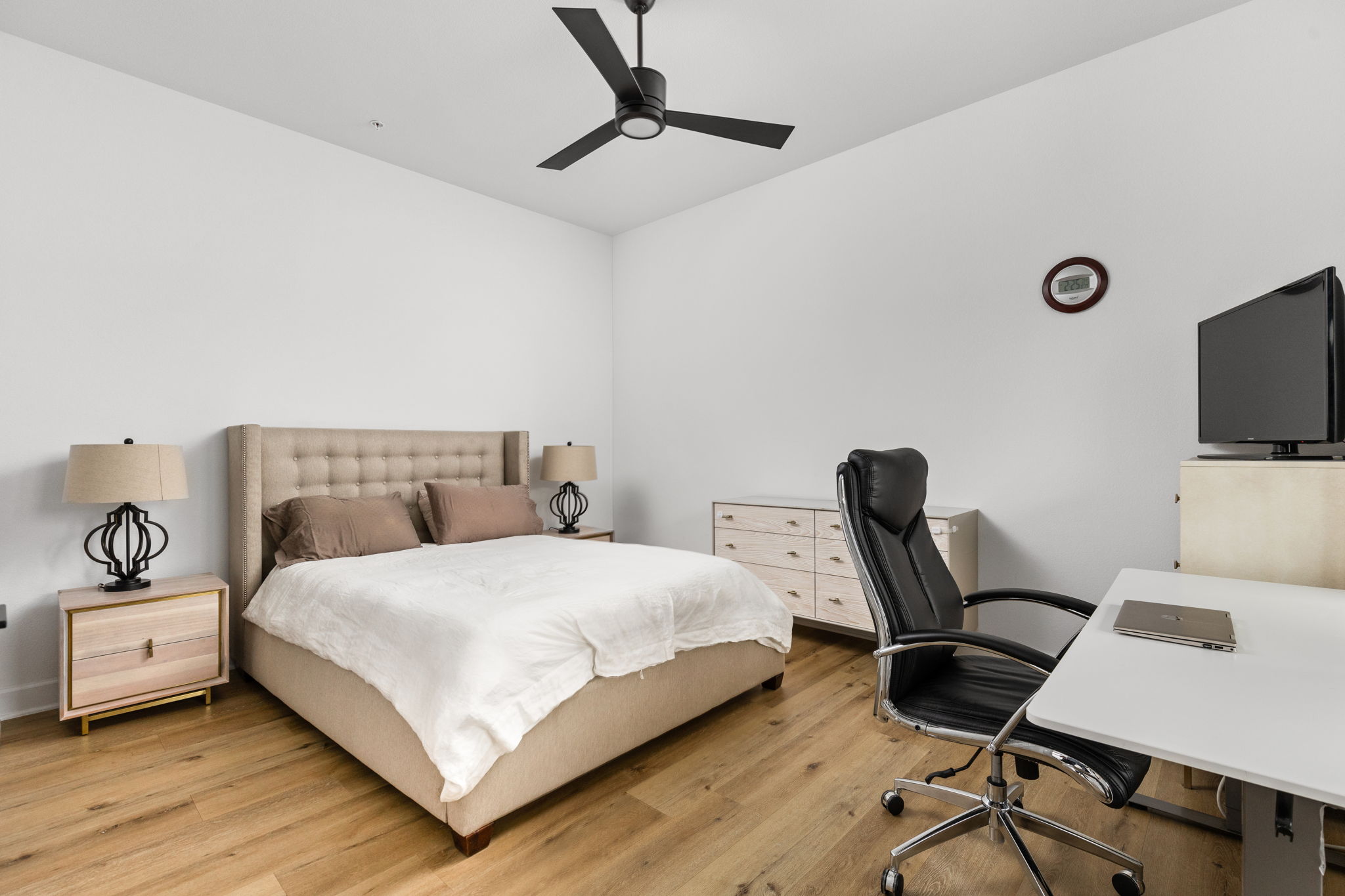 4710 Eberly Street Austin, TX 78723 - Photo 11 of 36 a bedroom with a bed and a flat screen tv