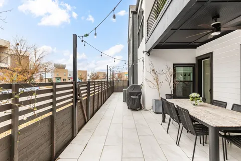 a bathroom with a double vanity sink toilet and shower