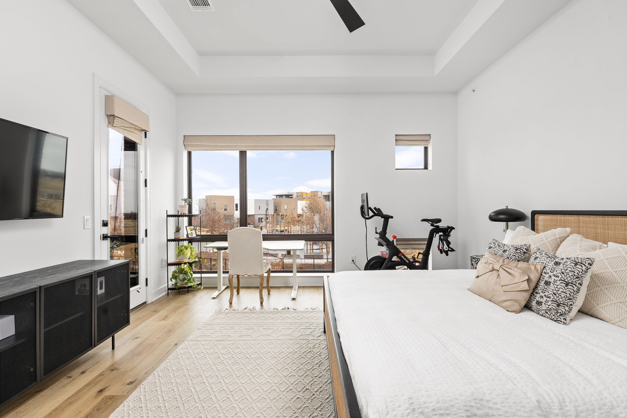 4710 Eberly Street Austin, TX 78723 - Photo 18 of 36 a large bedroom with a bed and large window