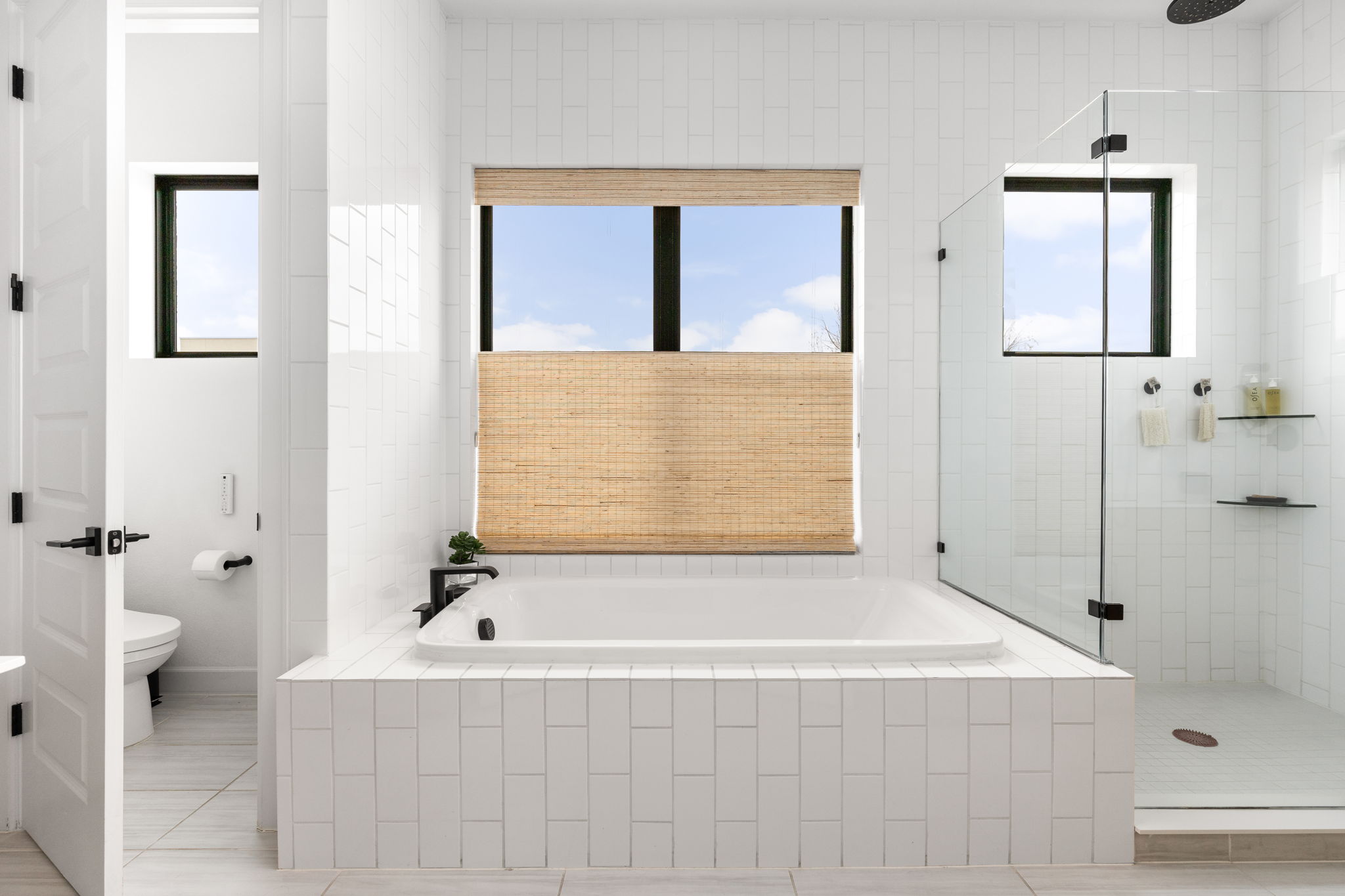 4710 Eberly Street Austin, TX 78723 - Photo 20 of 36 a bathroom with a bathtub and a shower