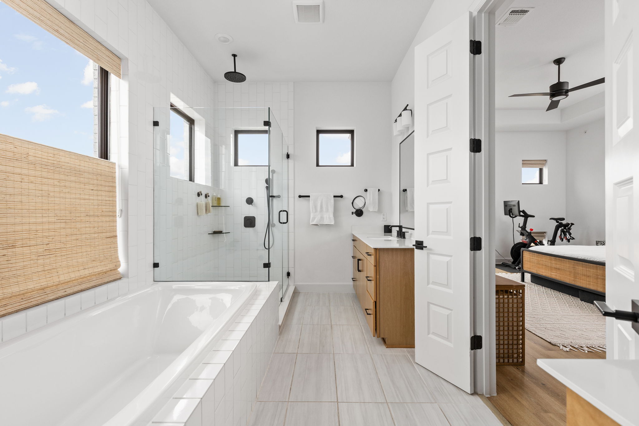 4710 Eberly Street Austin, TX 78723 - Photo 21 of 36 a bathroom with a tub sink and shower