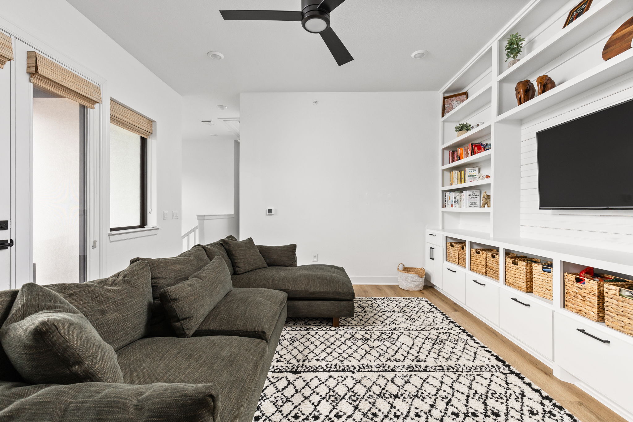 4710 Eberly Street Austin, TX 78723 - Photo 27 of 36 a living room with furniture and a flat screen tv