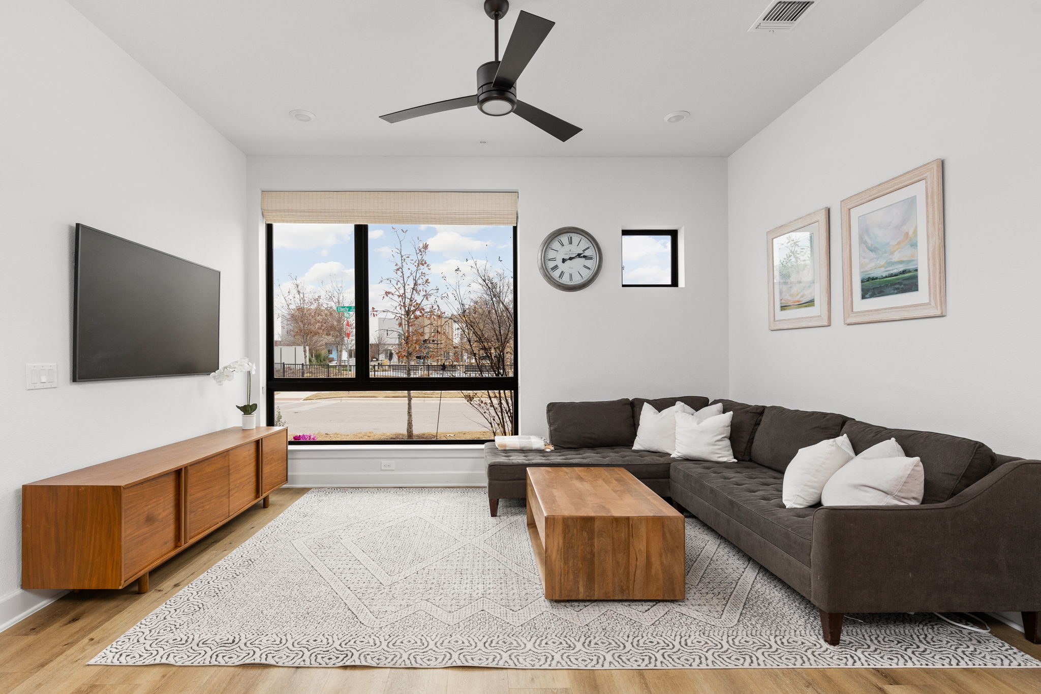 4710 Eberly Street Austin, TX 78723 - Photo 5 of 36 a living room with furniture and a flat screen tv