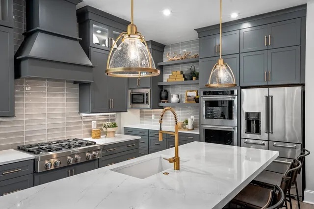 a spacious bathroom with a double vanity sink a two mirror a window and a bathtub
