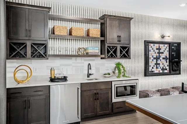 a bedroom with bed and a chandelier