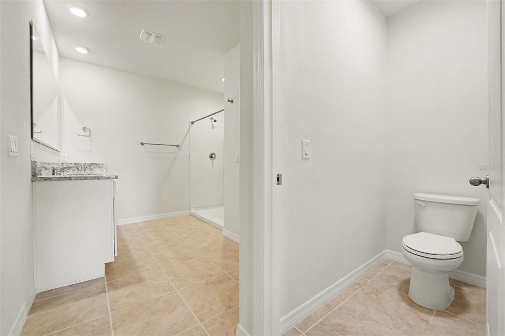 2795 Grandbury Grove Road Lakeland, FL 33811 - Photo 14 of 35 a bathroom with a toilet and a sink