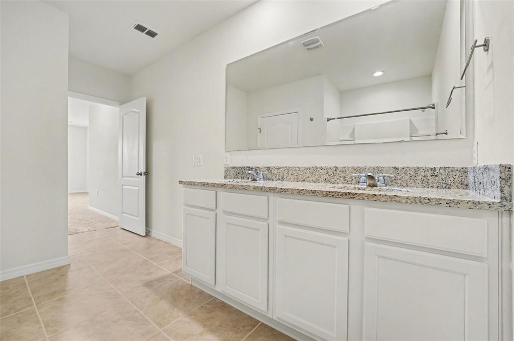 2795 Grandbury Grove Road Lakeland, FL 33811 - Photo 16 of 35 a view of granite countertop cabinets and a sink