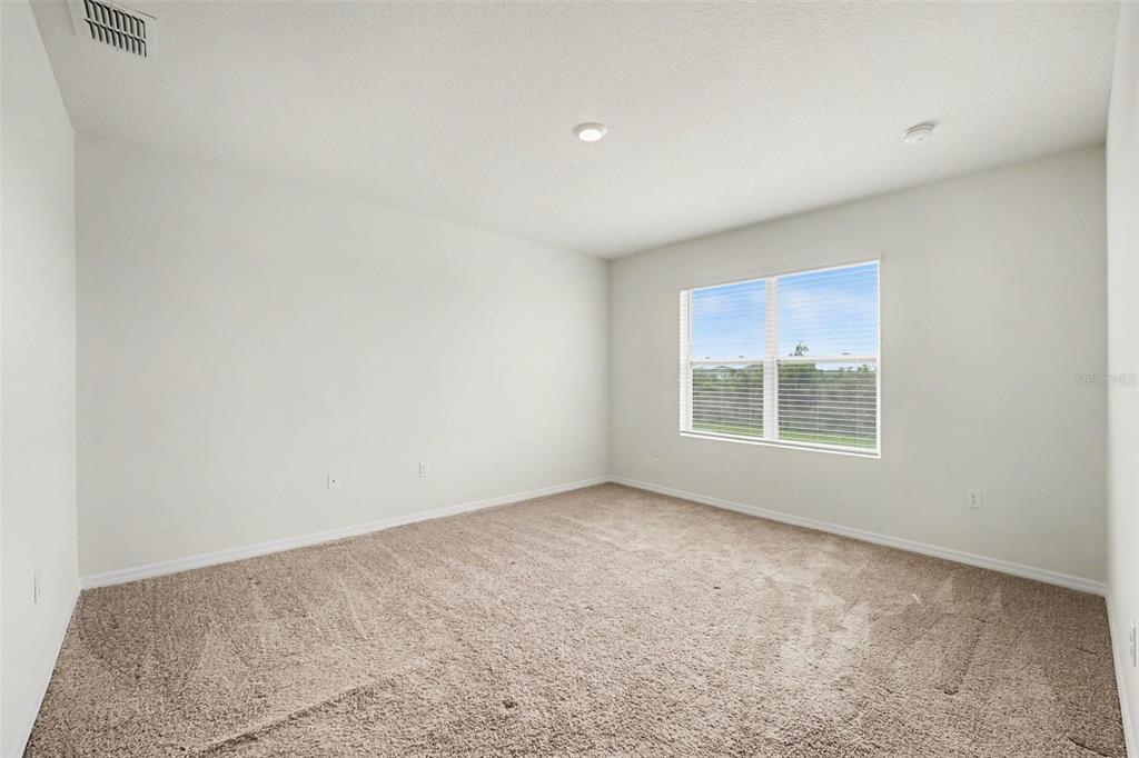 2795 Grandbury Grove Road Lakeland, FL 33811 - Photo 18 of 35 an empty room with a window