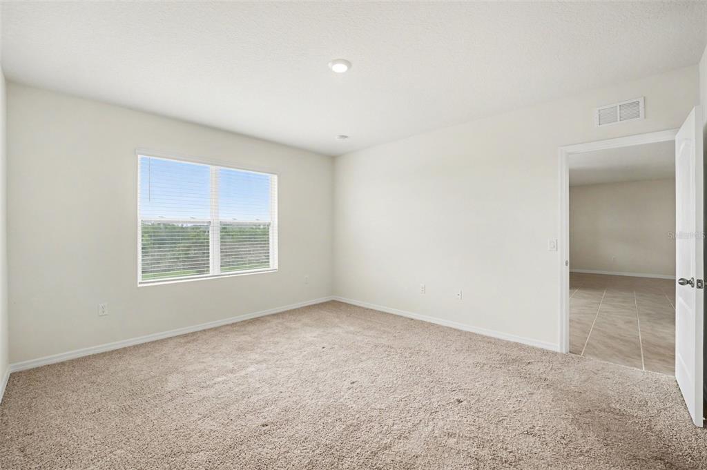 2795 Grandbury Grove Road Lakeland, FL 33811 - Photo 20 of 35 an empty room with a window