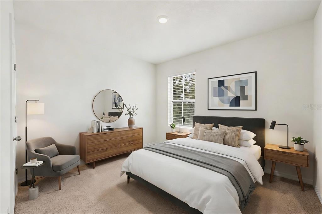 2795 Grandbury Grove Road Lakeland, FL 33811 - Photo 24 of 35 a bedroom with bed and a window