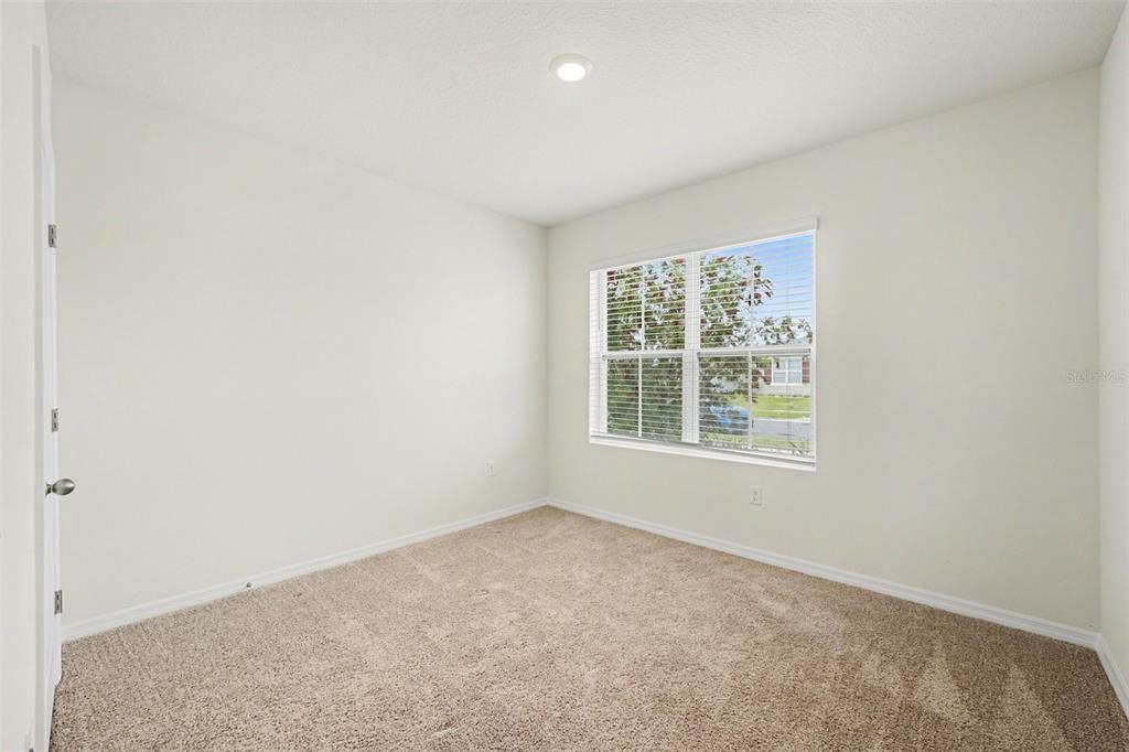 2795 Grandbury Grove Road Lakeland, FL 33811 - Photo 25 of 35 an empty room with a window