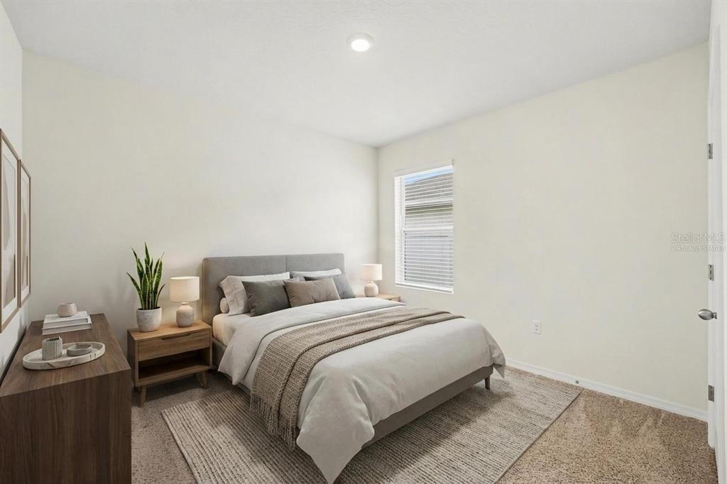 2795 Grandbury Grove Road Lakeland, FL 33811 - Photo 27 of 35 a bedroom with a bed and window