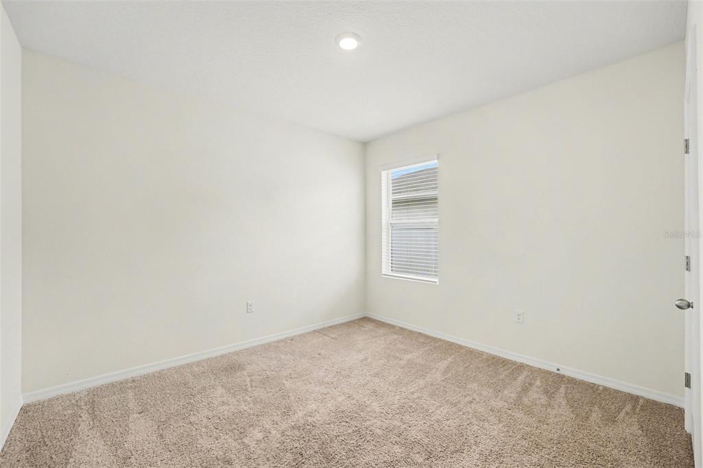 2795 Grandbury Grove Road Lakeland, FL 33811 - Photo 28 of 35 an empty room with a window