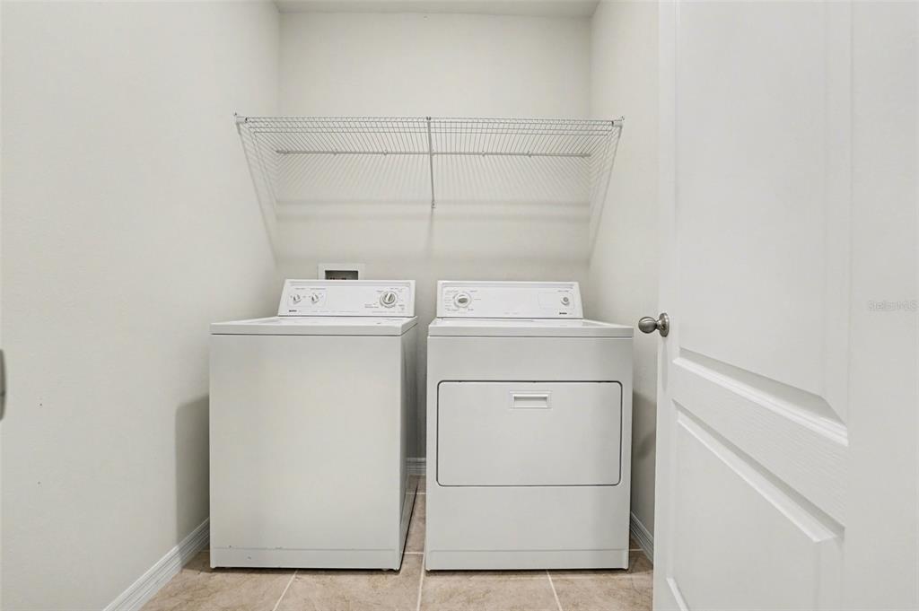 2795 Grandbury Grove Road Lakeland, FL 33811 - Photo 30 of 35 a utility room with dryer and washer