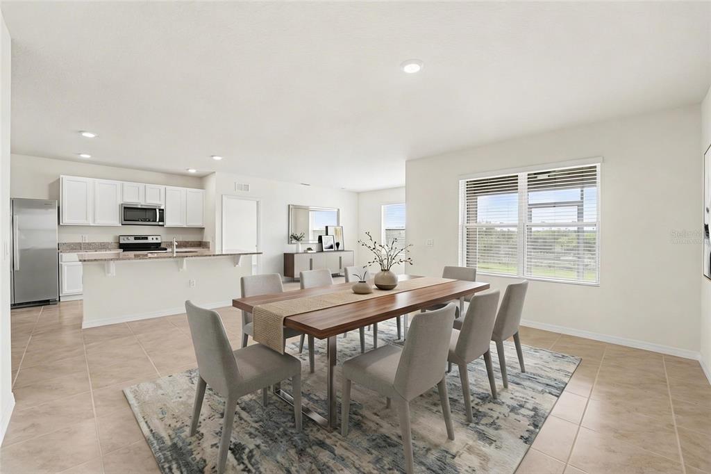 2795 Grandbury Grove Road Lakeland, FL 33811 - Photo 8 of 35 a view of a dining room with furniture