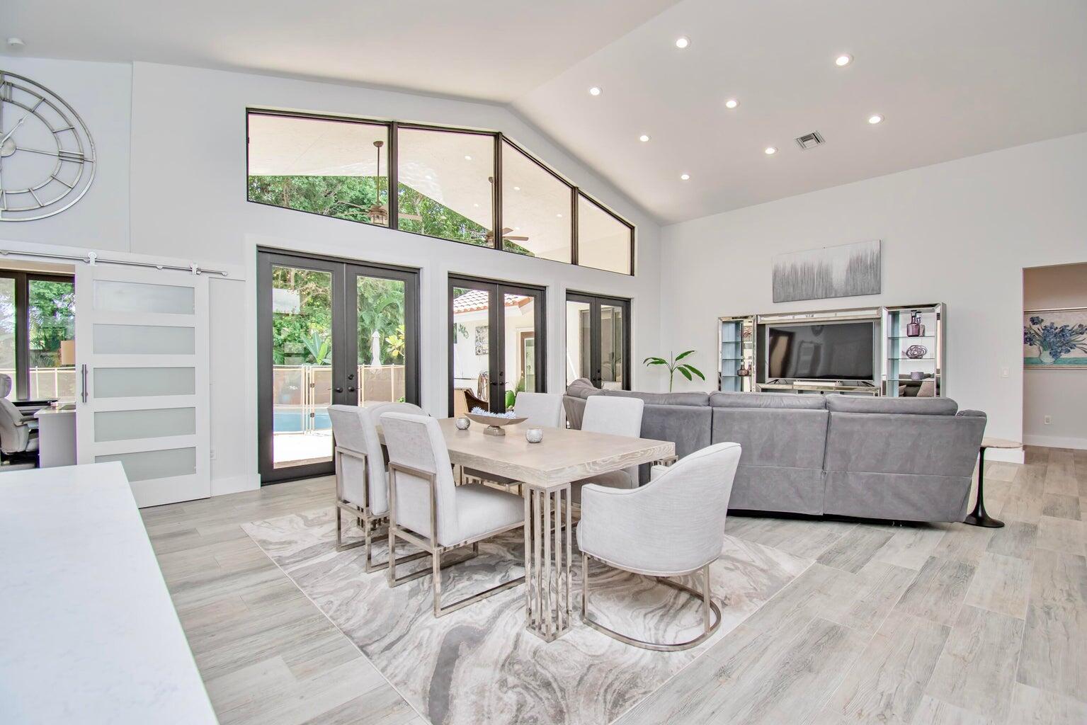 2302 Northwest 66th Drive Boca Raton, FL 33496 - Photo 15 of 53 a living room with furniture and a large window