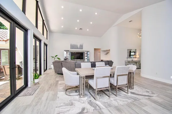 a view of a dining room with furniture window and wooden floor