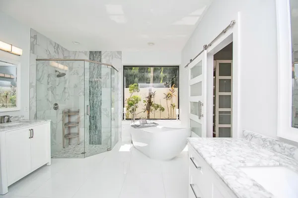 a bathroom with a shower and a tub
