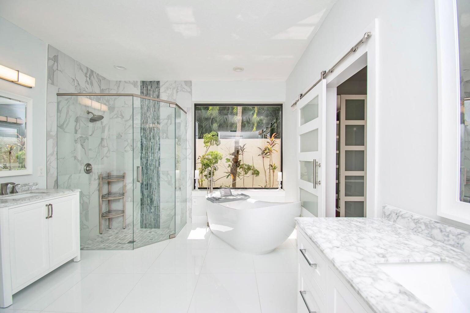 2302 Northwest 66th Drive Boca Raton, FL 33496 - Photo 30 of 53 a living room with a large window and a wooden floor