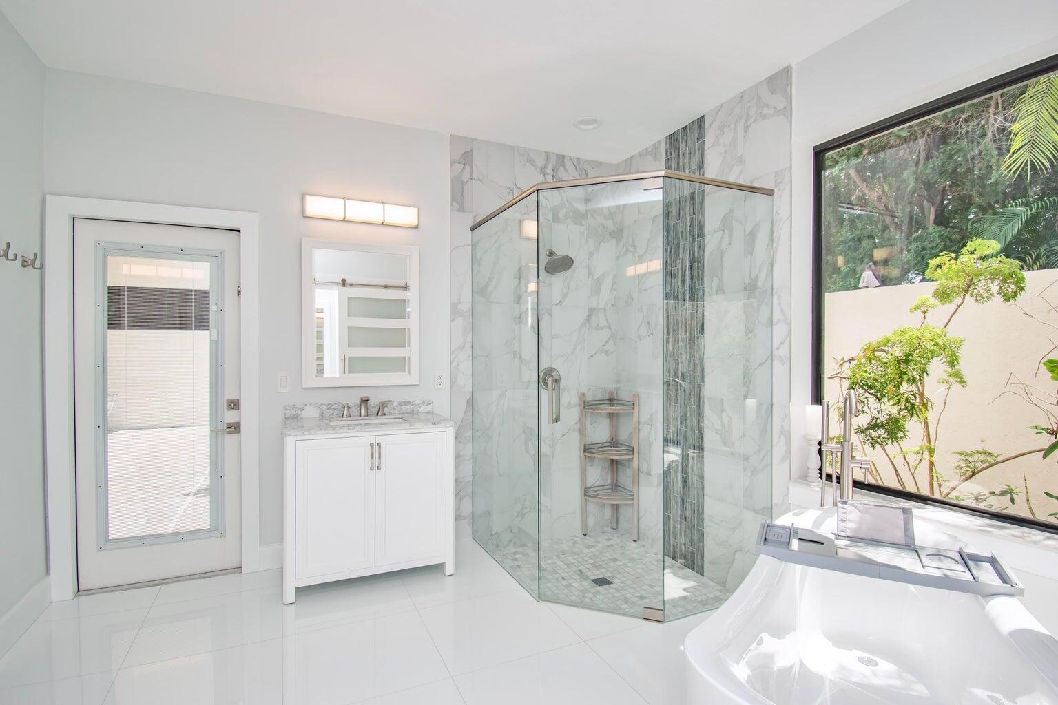 2302 Northwest 66th Drive Boca Raton, FL 33496 - Photo 31 of 53 a bathroom with a shower and a tub