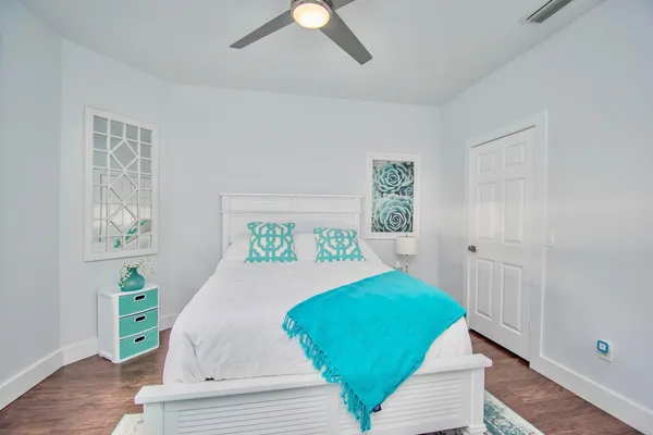 a spacious bedroom with a bed and window