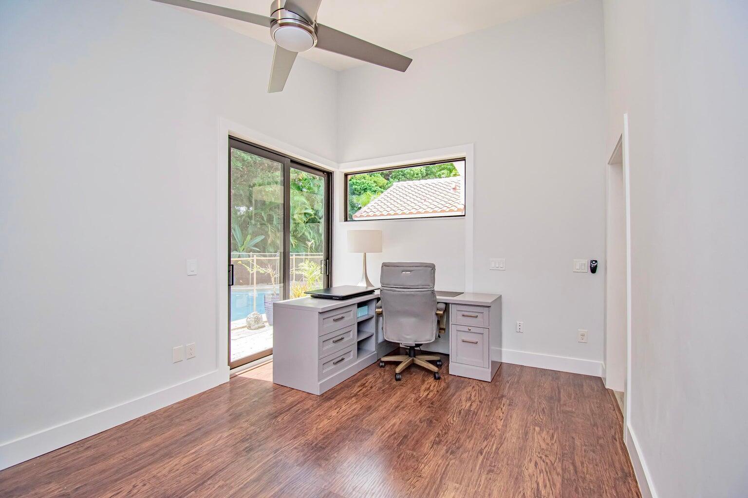 2302 Northwest 66th Drive Boca Raton, FL 33496 - Photo 42 of 53 a living room with furniture and a wooden floor