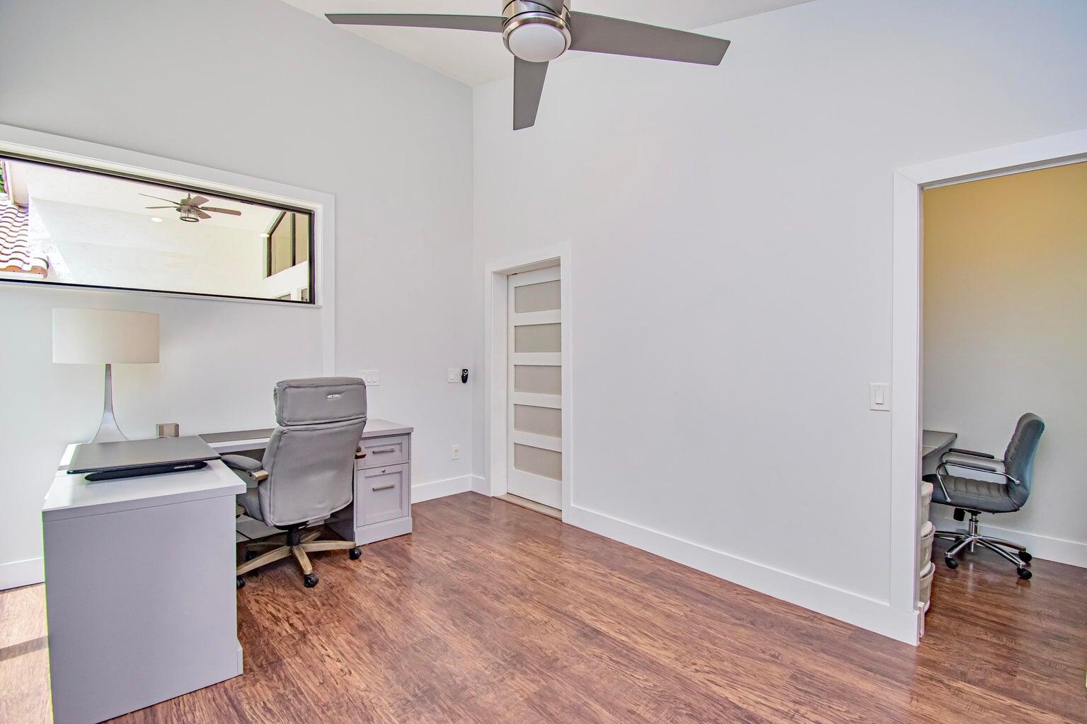2302 Northwest 66th Drive Boca Raton, FL 33496 - Photo 43 of 53 a view of a workspace with furniture and a window