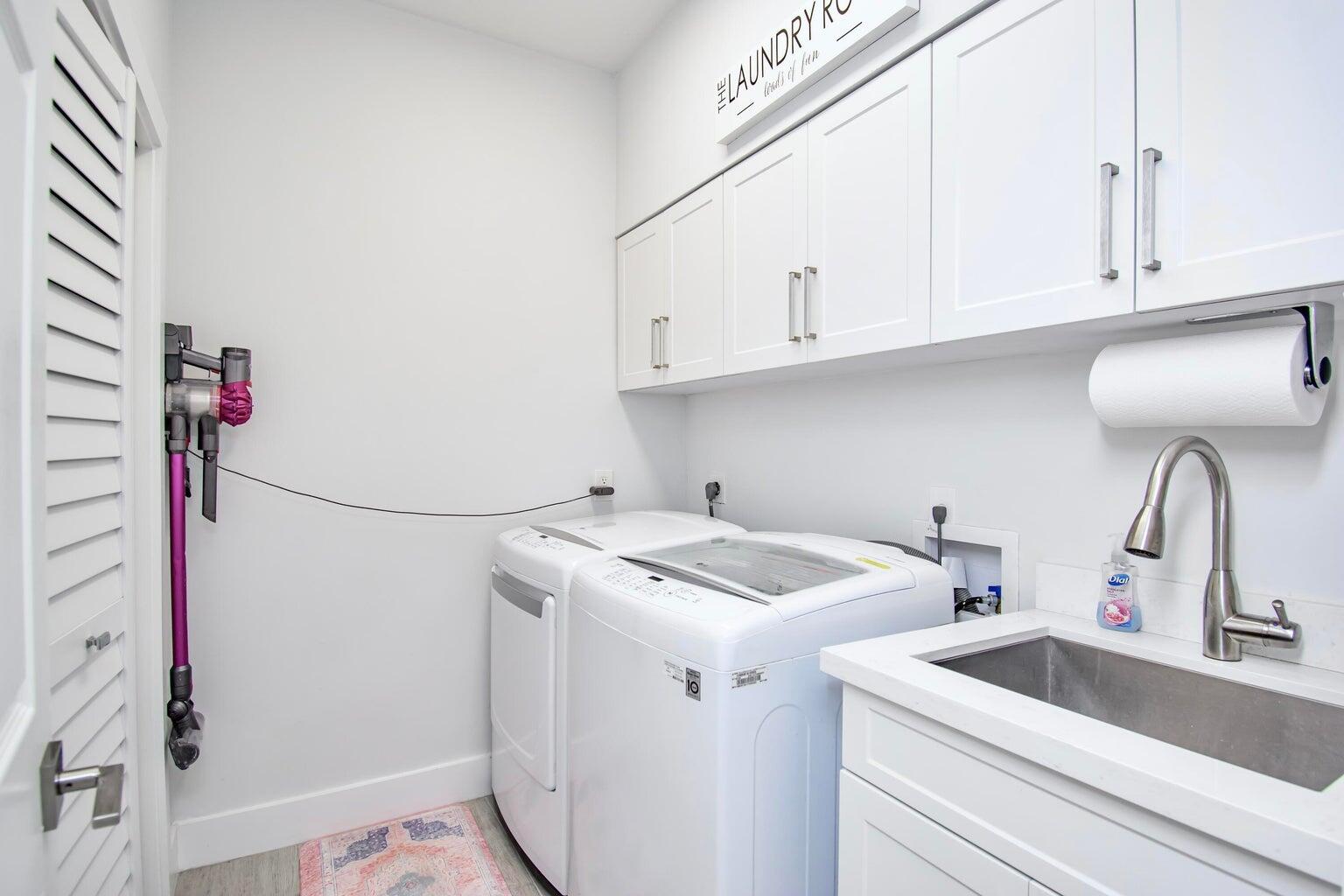 2302 Northwest 66th Drive Boca Raton, FL 33496 - Photo 44 of 53 a utility room with dryer and washer