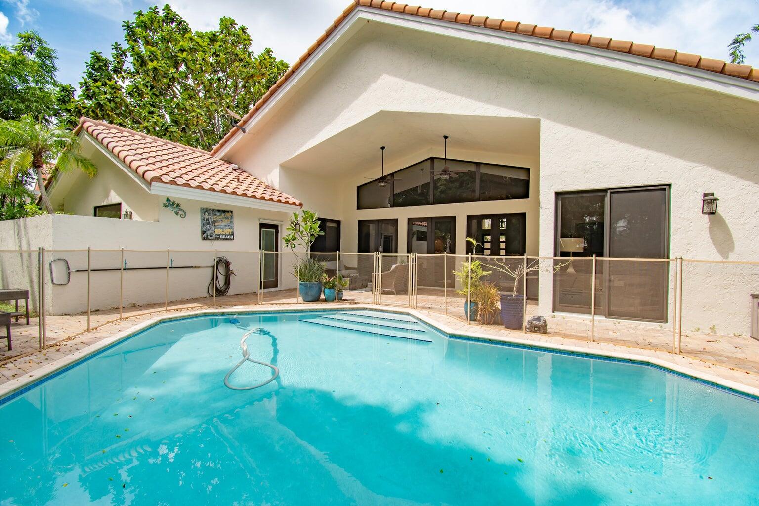2302 Northwest 66th Drive Boca Raton, FL 33496 - Photo 45 of 53 a view of a house with a swimming pool