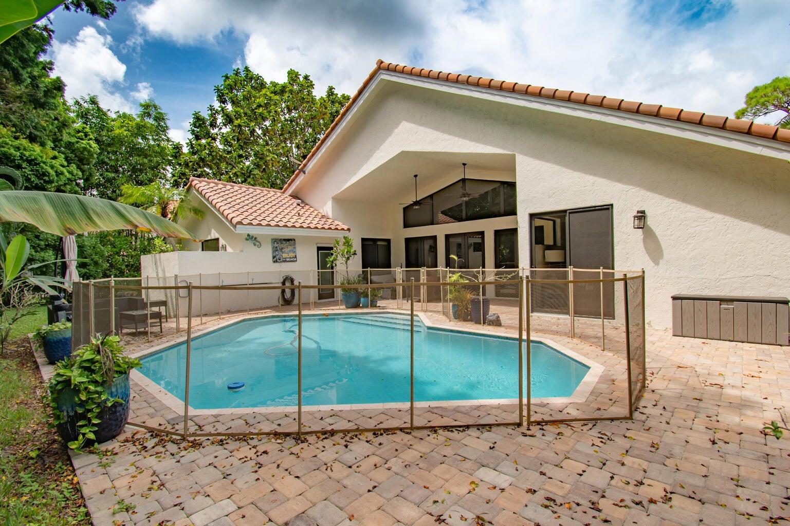 2302 Northwest 66th Drive Boca Raton, FL 33496 - Photo 47 of 53 a view of a house with a backyard