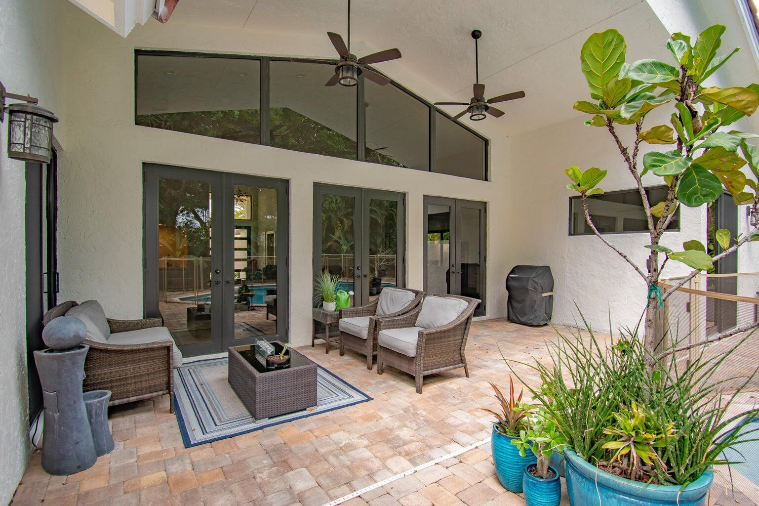 2302 Northwest 66th Drive Boca Raton, FL 33496 - Photo 49 of 53 a building outdoor space with patio furniture