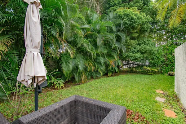 a view of a garden with a fountain