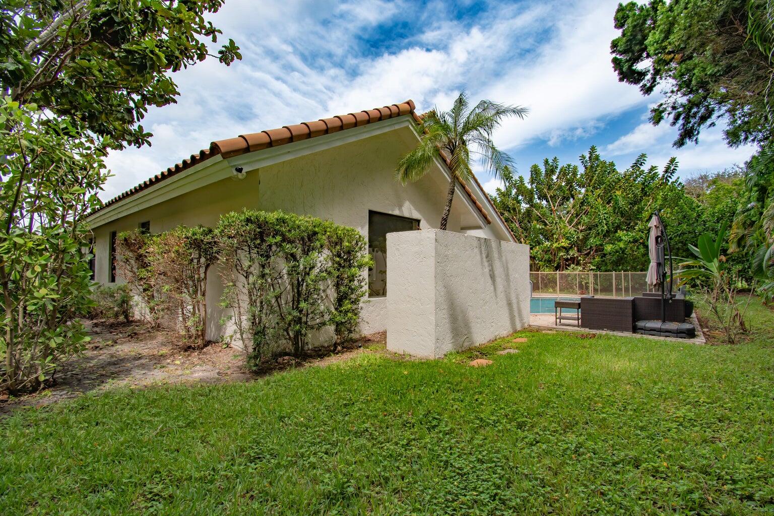 2302 Northwest 66th Drive Boca Raton, FL 33496 - Photo 51 of 53 a view of backyard with a garden and plants
