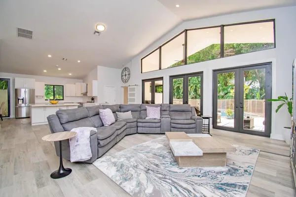 a living room with furniture and a large window