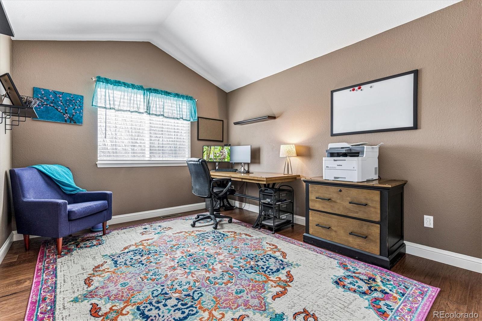 4597 Whitehall Lane Highlands Ranch, CO 80126 - Photo 34 of 50 a room with a couch and a dresser in it