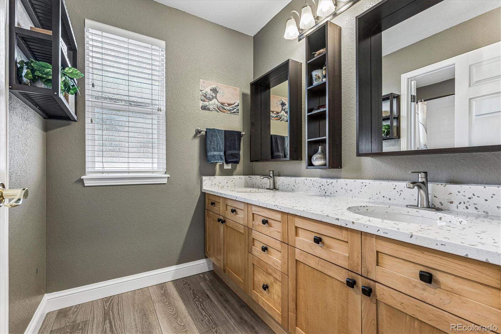 4597 Whitehall Lane Highlands Ranch, CO 80126 - Photo 35 of 50 a bathroom with a sink and a mirror