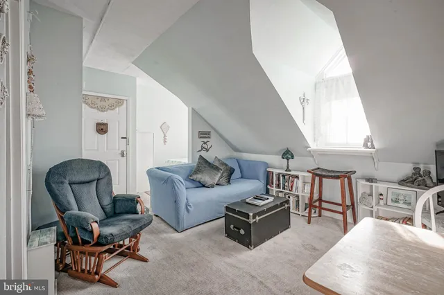 a bedroom with a bed and a chair