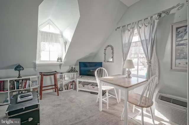 a bathroom with a granite countertop sink a mirror and shower