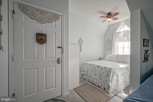a bathroom with a sink toilet and window