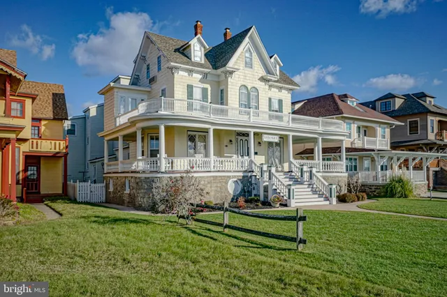 a front view of a house with a yard table and chairs