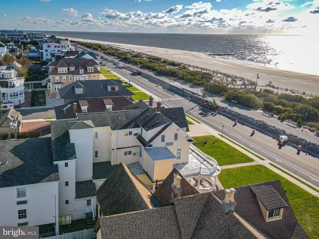 a roof deck with couch and city view