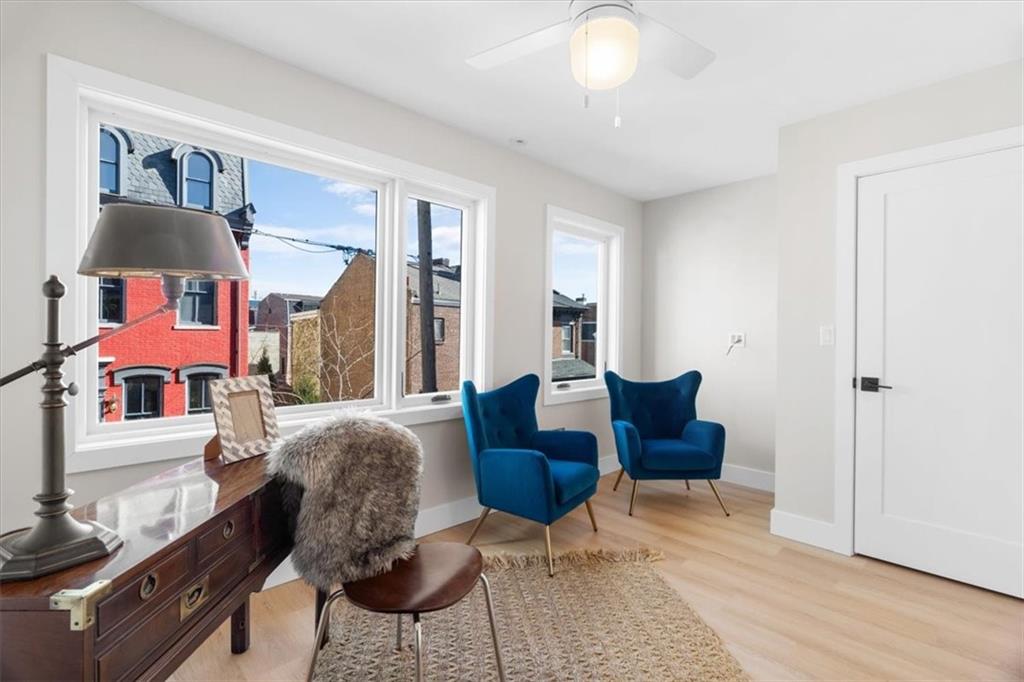 1213 Boyle Street Pittsburgh, PA 15212 - Photo 15 of 31 a living room with furniture and a window